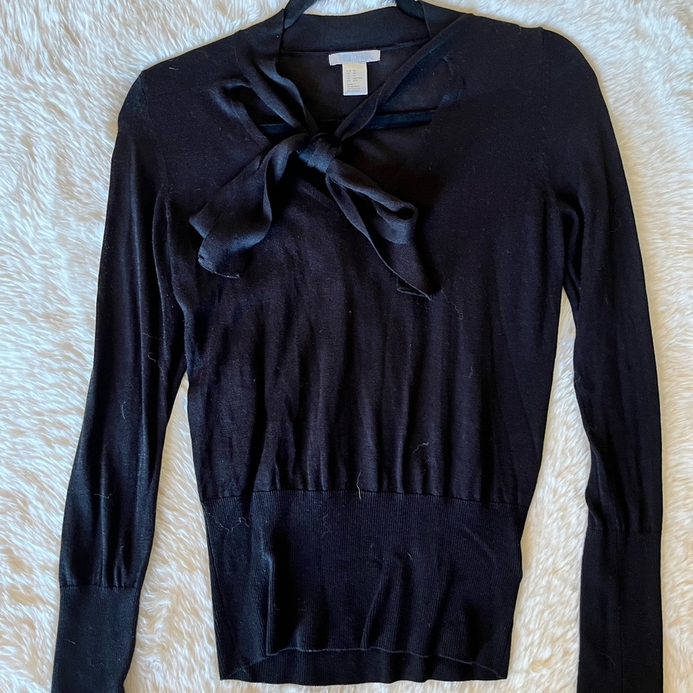 Black sweater with bow